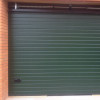 Sectional garage doors 40 mm RIB / stucco color-RAL 6009 Dark green