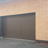 Sectional garage doors 40 mm RIB / woodgrain color-RAL 8017 brown