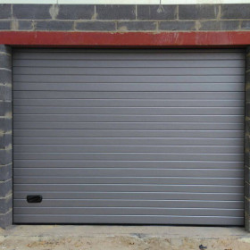 Garage sectional doors 40 mm RIB / woodgrain color-RAL 9006 silver