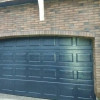 Garage sectional doors 40 mm CASSETE / Woodgrain color-RAL 9005 black